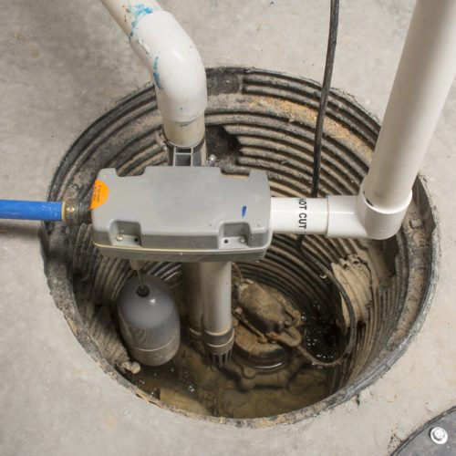 A,Sump,Pump,Installed,In,A,Basement,Of,A,Home