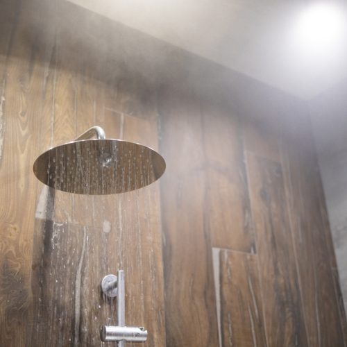 Close,Up,Of,Hot,Water,Flowing,From,Shower,In,The